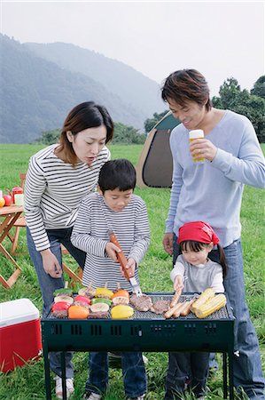 family in mountain picnic - Family having barbeque Stock Photo - Premium Royalty-Free, Code: 685-02939070