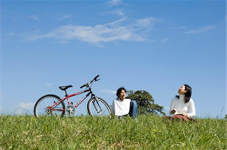 simsearch:685-02939247,k - Young couple sitting next to bicycle Stock Photo - Premium Royalty-Free, Code: 685-02939244