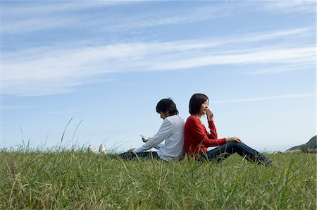 simsearch:685-02939244,k - Young couple sitting back to back Stock Photo - Premium Royalty-Free, Code: 685-02939257