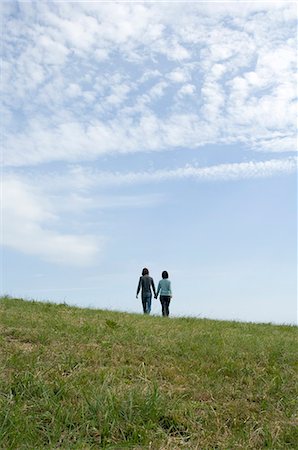simsearch:685-02939244,k - Young couple walking holding hands, rear view Stock Photo - Premium Royalty-Free, Code: 685-02939266