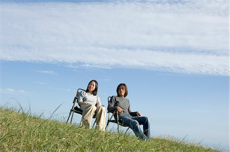 simsearch:685-02939244,k - Young couple sitting in chairs Stock Photo - Premium Royalty-Free, Code: 685-02939263
