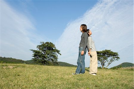 simsearch:685-02939247,k - Young couple standing back to back Stock Photo - Premium Royalty-Free, Code: 685-02939274