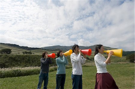 simsearch:685-02939247,k - Four young people shouting into megaphones Stock Photo - Premium Royalty-Free, Code: 685-02939279