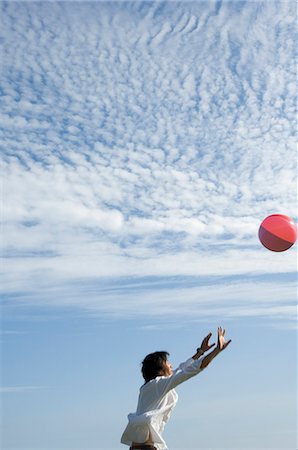 simsearch:685-02939247,k - Young man playing with beach ball Stock Photo - Premium Royalty-Free, Code: 685-02939289