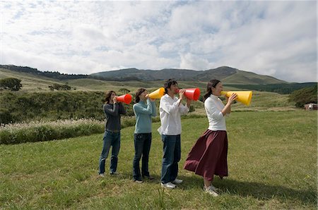 simsearch:685-02939247,k - Four young people shouting into megaphones Stock Photo - Premium Royalty-Free, Code: 685-02939280