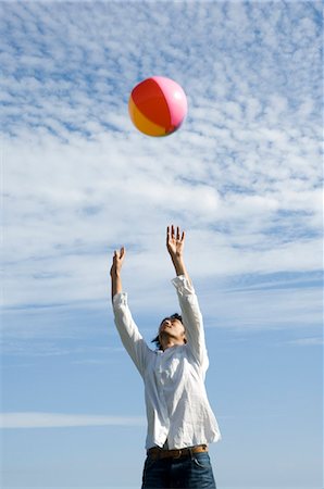 simsearch:685-02939247,k - Young man playing with beach ball Stock Photo - Premium Royalty-Free, Code: 685-02939290