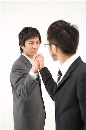 Two businessmen shaking hands Stock Photo - Premium Royalty-Free, Code: 685-02939335