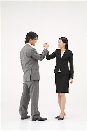 Two business people shaking hands Stock Photo - Premium Royalty-Free, Code: 685-02939340