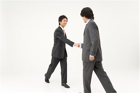 Two businessmen shaking hands Foto de stock - Sin royalties Premium, Código: 685-02939365