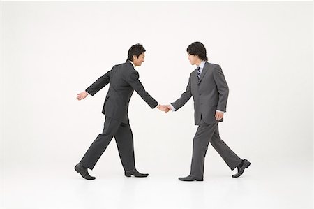 Two businessmen shaking hands Foto de stock - Sin royalties Premium, Código: 685-02939368