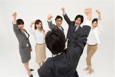 Business people cheering Stock Photo - Premium Royalty-Free, Code: 685-02939385