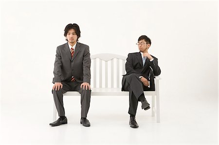 Two businessmen sitting on bench Stock Photo - Premium Royalty-Free, Code: 685-02939460
