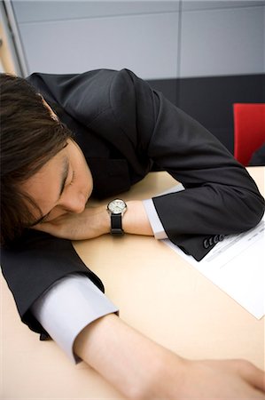 Young businessman sleeping during meeting Stock Photo - Premium Royalty-Free, Code: 685-02939666