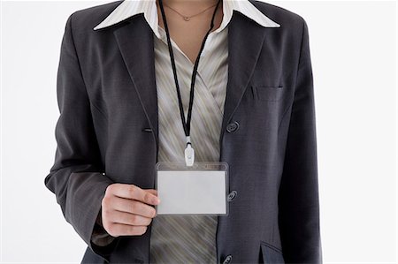 simsearch:685-02940140,k - Businesswoman wearing ID card Stock Photo - Premium Royalty-Free, Code: 685-02940125