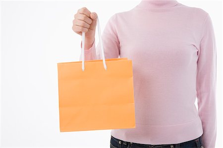 simsearch:685-02940140,k - Woman holding paper bag Stock Photo - Premium Royalty-Free, Code: 685-02940155