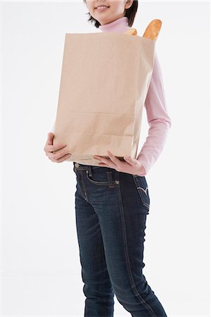 simsearch:685-02940140,k - Woman holding paper bag Stock Photo - Premium Royalty-Free, Code: 685-02940152