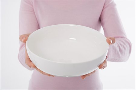 simsearch:685-02940140,k - Woman holding empty bowl Stock Photo - Premium Royalty-Free, Code: 685-02940160