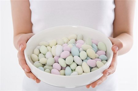 simsearch:685-02940140,k - Woman holding bowl of candies Stock Photo - Premium Royalty-Free, Code: 685-02940161