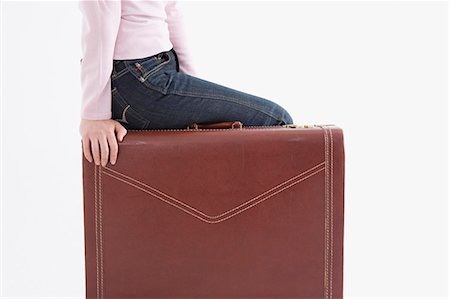 simsearch:685-02940140,k - Woman sitting on suitcase Stock Photo - Premium Royalty-Free, Code: 685-02940162