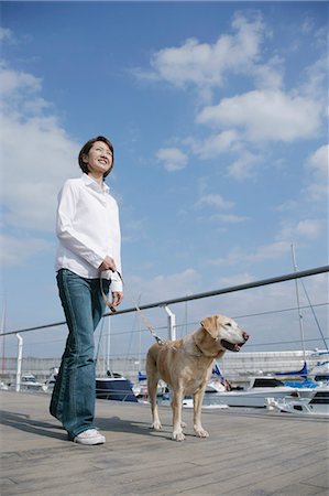 dog walk asian - Young woman and Labrador retriever Stock Photo - Premium Royalty-Free, Code: 685-02940251