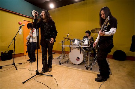 Rock band in rehearsal Foto de stock - Sin royalties Premium, Código: 685-02940313