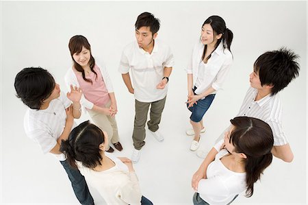 Young people standing in circle Stock Photo - Premium Royalty-Free, Code: 685-02940453