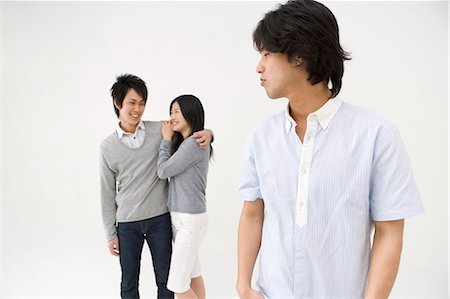 Young man and couple Stock Photo - Premium Royalty-Free, Code: 685-02940529