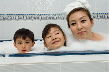 Mother and children taking bath Stock Photo - Premium Royalty-Free, Code: 685-02940667