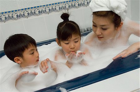Mother and children taking bath Stock Photo - Premium Royalty-Free, Code: 685-02940668