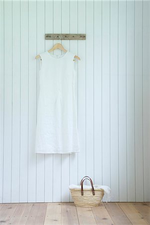 Linen dress hanging on wall Stock Photo - Premium Royalty-Free, Code: 685-02941078