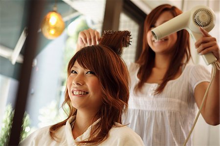 salon pictures with customer in a dryer - Hairdresser drying woman's hair Stock Photo - Premium Royalty-Free, Code: 685-02941446