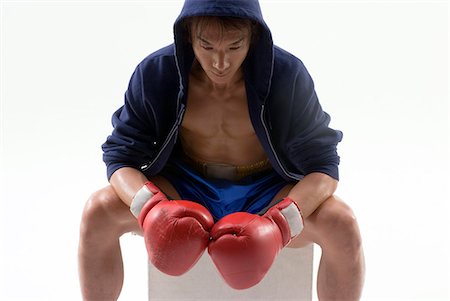 Boxer sitting Stock Photo - Premium Royalty-Free, Code: 685-02941761