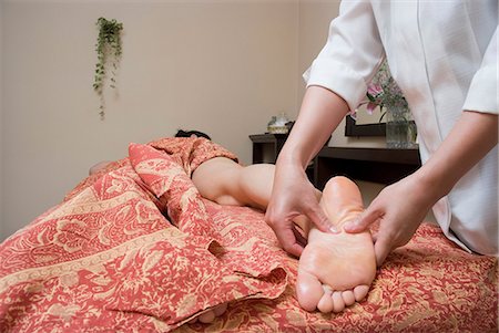 Therapist massaging patient's foot Stock Photo - Premium Royalty-Free, Code: 685-02941919