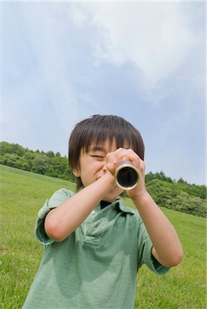 person with telescope - Boy using telescope Stock Photo - Premium Royalty-Free, Code: 685-03081304