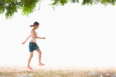 skipping human images - Young woman walking at beach Stock Photo - Premium Royalty-Free, Code: 685-03081625