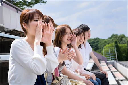 College students cheering at stadium Stock Photo - Premium Royalty-Free, Code: 685-03081685