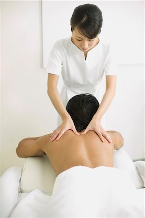 simsearch:685-02937281,k - Massage therapist applying body massage Stock Photo - Premium Royalty-Free, Code: 685-03081821