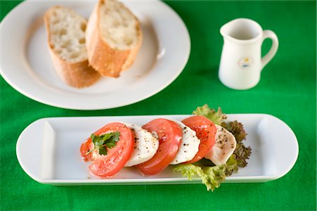 Insalata di caprese and bread Stock Photo - Premium Royalty-Free, Code: 685-03081914