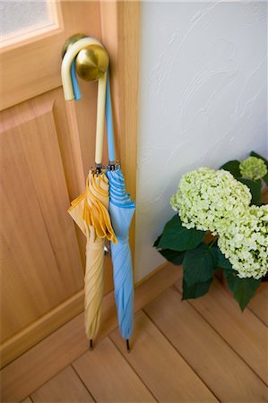 Umbrella and hydrangea in front of door Stock Photo - Premium Royalty-Free, Code: 685-03082028