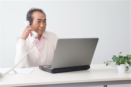 Businessman working in office Stock Photo - Premium Royalty-Free, Code: 685-03082206