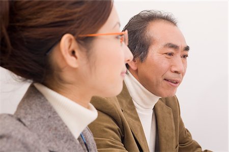 Mature man and young woman working Foto de stock - Sin royalties Premium, Código: 685-03082263