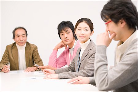 Four people discussing in meeting room Stock Photo - Premium Royalty-Free, Code: 685-03082273