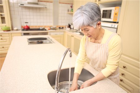 Senior woman cooking Stock Photo - Premium Royalty-Free, Code: 685-03082308