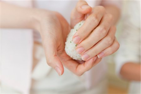 rice ball - Human Hand cooking Stock Photo - Premium Royalty-Free, Code: 685-03082411