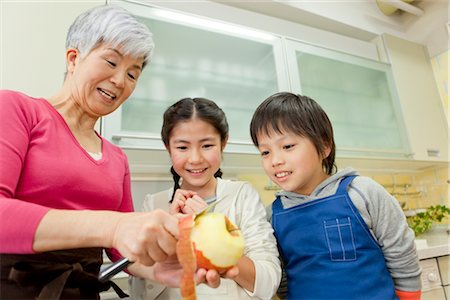 Grandmother cooking with grandchildren Stock Photo - Premium Royalty-Free, Code: 685-03082424