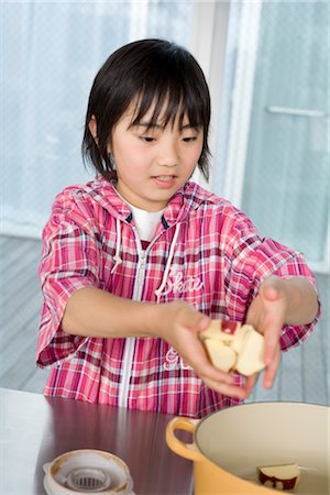 Boy cooking in kitchen Stock Photo - Premium Royalty-Free, Code: 685-03082678