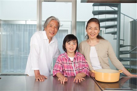 Grandparents and grandson standing in kitchen Stock Photo - Premium Royalty-Free, Code: 685-03082681