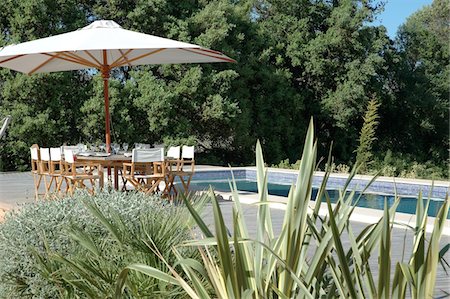 seating at the pool - Mediterranean garden with pool Stock Photo - Premium Royalty-Free, Code: 689-05610323