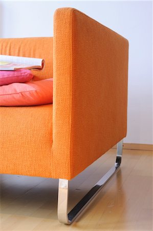 floor cushion - Detail of an orange sofa Stock Photo - Premium Royalty-Free, Code: 689-05610660