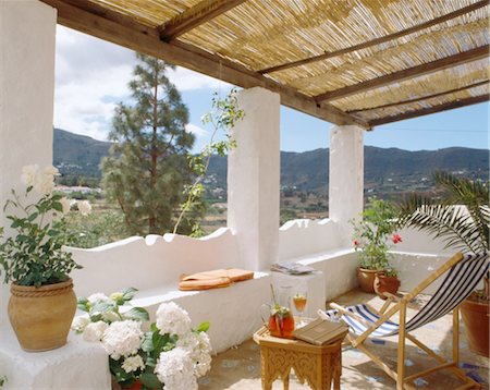 spain countryside - Deckchair under roofed balcony Stock Photo - Premium Royalty-Free, Code: 689-05610826